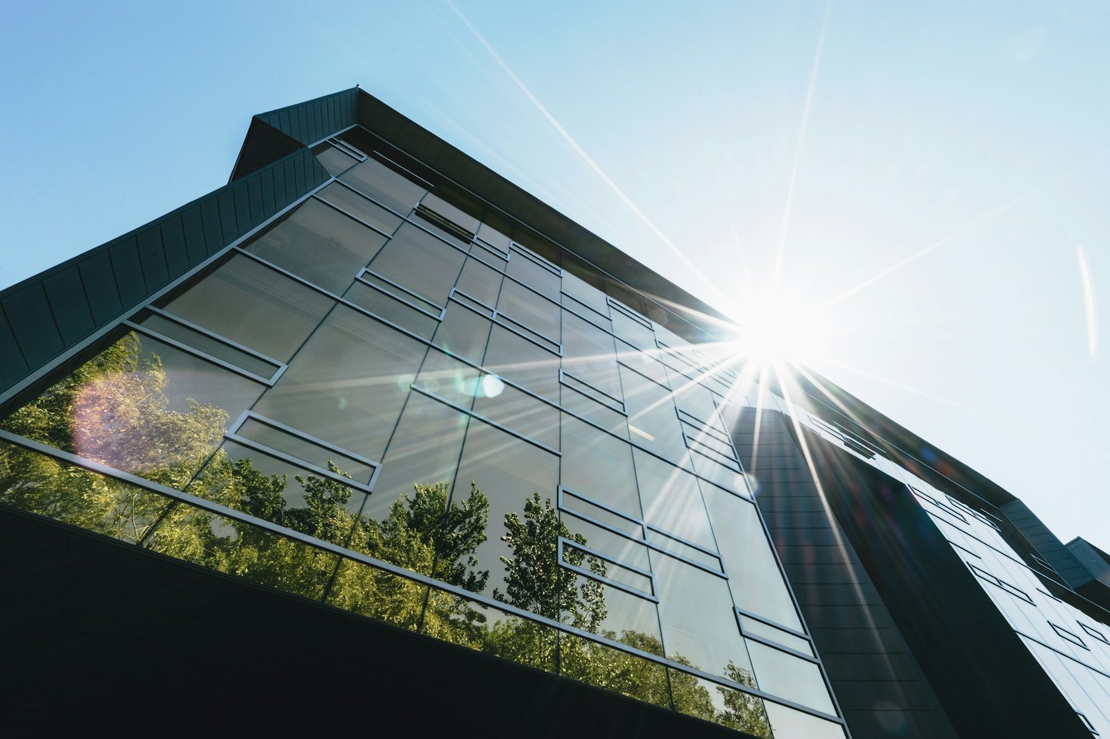 Modern glass commercial building photographed in daylight